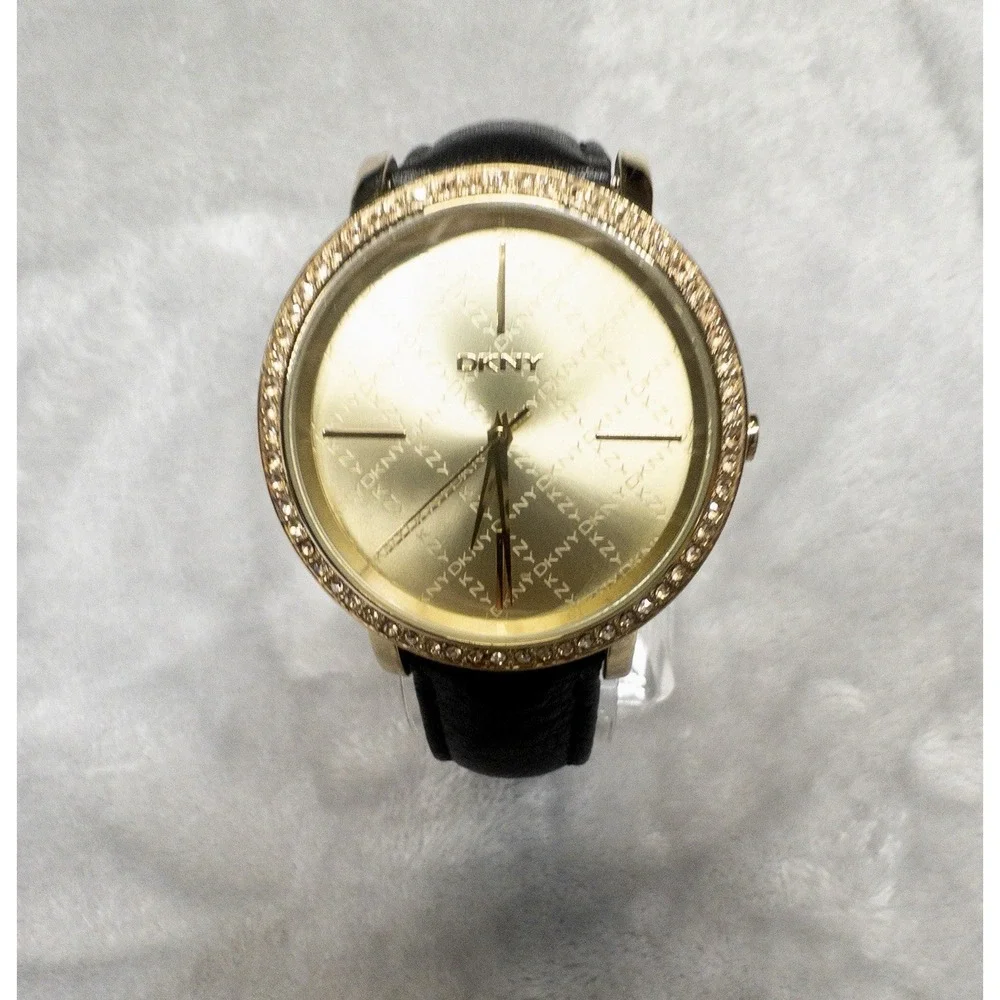 DKNY 111007 Gold Tone All Over Logo Womens 43mm Wristwatch Gem Set Bezel